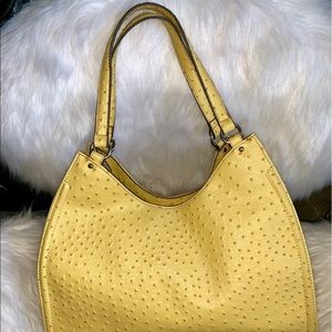 Yellow two strap purse.